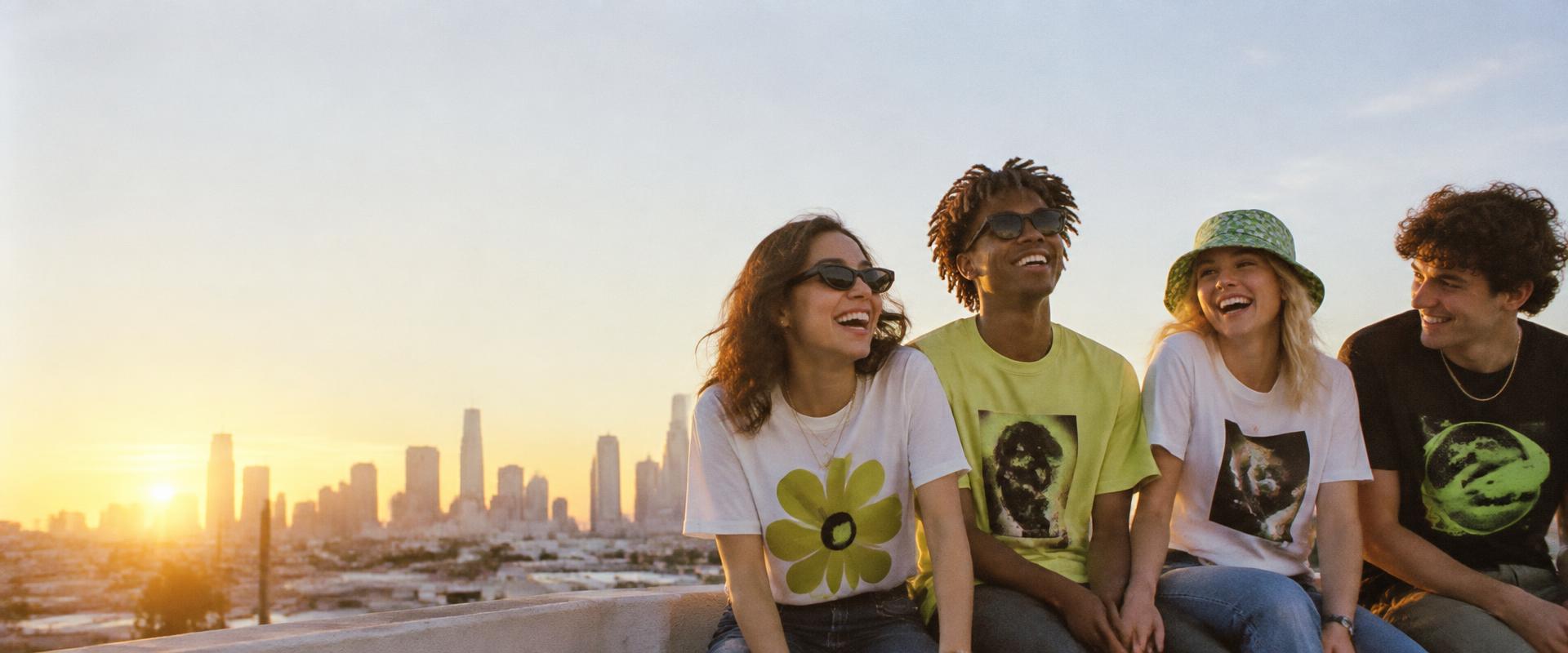 Friends wearing graphic T-shirts on a rooftop
